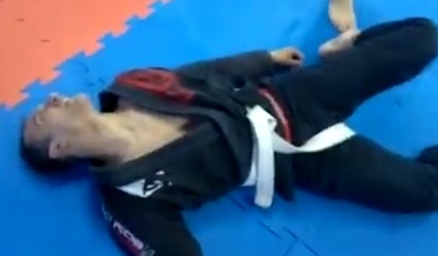 Black Belt chokes out white belt and leaves him