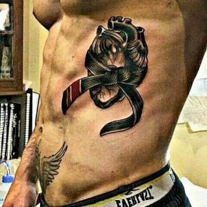 Brazilian jiu jitsu tattoo black belt on ribs