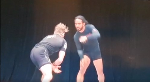 Watch Benson Henderson's Double Leg Taking Down AJ Agazarm and the Referee off the stage