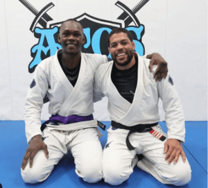 Israel Adesanya and Andre Glalvao bjj purple belt promotion