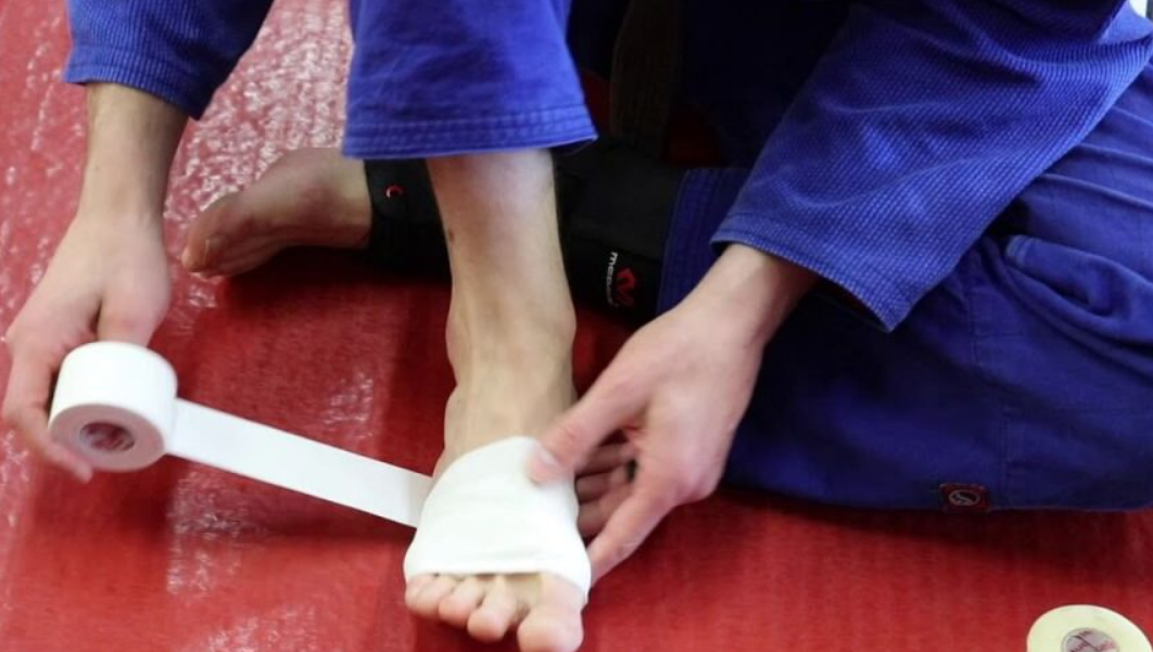 Atheltic tape for mat burned feet in BJJ and wrestling