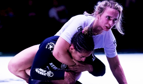 The fighter in the picture Ffion Davies is attempting to maintain back control and transition to a Rear-Naked Choke (RNC) submission.