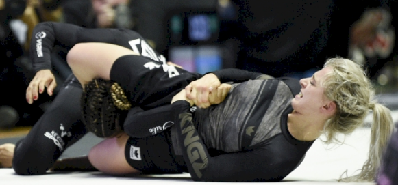 The fighter successfully transitions to an Arm Lock from the Triangle position.