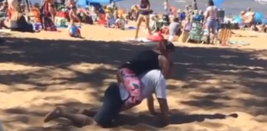 A BJJ practitioner finishes a person with a Rear Naked Choke (RNC) submission.